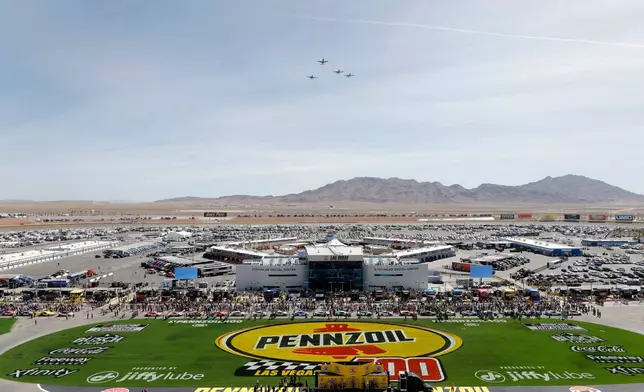 Air Force A-10C fighter planes fly over Las Vegas Motor Speedway before a NASCAR Cup Series auto race Sunday, March 15, 2026, in Las Vegas. (AP Photo/Steve Marcus)