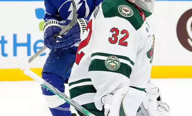 Tampa Bay Lightning center Jake Guentzel (59) celebrates after scoring past Minnesota Wild goaltender Filip Gustavsson (32) during the second period of an NHL hockey game Tuesday, March 24, 2026, in Tampa, Fla. (AP Photo/Chris O'Meara)