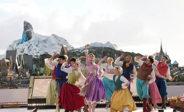 Dancers perform during the inauguration of Disney Adventure World and World Of Frozen at Disneyland Paris in Marne-la-Vallee, east of Paris, Saturday, March 28, 2026. (AP Photo/Christophe Ena)