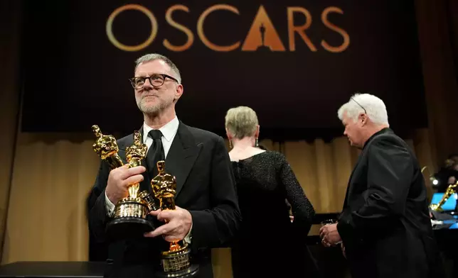 Paul Thomas Anderson, winner of the awards for writing (adapted screenplay), directing, and best picture for "One Battle After Another," attends the Governors Ball after the Oscars on Sunday, March 15, 2026, in Los Angeles. (AP Photo/John Locher)