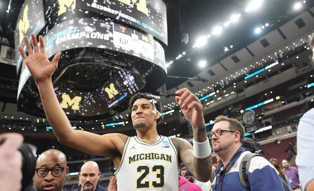 Michigan's Yaxel Lendeborg (23) celebrates after defeating Tennessee in the Elite Eight of the NCAA college basketball tournament, Sunday, March 29, 2026, in Chicago. (AP Photo/Erin Hooley)
