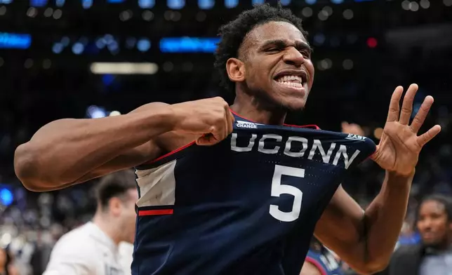 UConn forward Tarris Reed Jr. (5) reacts after the team's win against Duke in the Elite Eight of the NCAA college basketball tournament, Sunday, March 29, 2026, in Washington. (AP Photo/Abbie Parr)