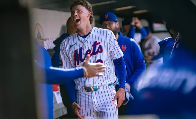 New York Mets' Carson Benge (3) celebrates scoring a home run during the sixth inning of his debut MLB game, an opening-day baseball game against the Pittsburgh Pirates, Thursday, March 26, 2026, in New York. (AP Photo/Angelina Katsanis)