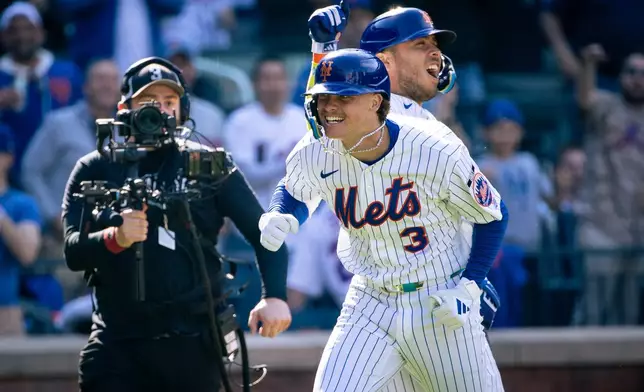 New York Mets' Carson Benge (3) celebrates after hitting a home run in the sixth inning of an opening-day baseball game against the Pittsburgh Pirates, Thursday, March 26, 2026, in New York. (AP Photo/Angelina Katsanis)