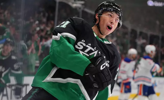Dallas Stars left wing Jason Robertson reacts after scoring a goal during the first period of an NHL hockey game against the Edmonton Oilers, Thursday, March 12, 2026, in Dallas. (AP Photo/LM Otero)