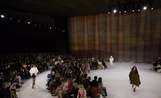 Models wear creations from the Chloe Fall/Winter 2026-2027 Women's collection presented in Paris, Thursday, March 5, 2026. (AP Photo/Tom Nicholson)