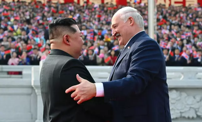 In this photo released by Belarus' Presidential Press Service, North Korea's leader Kim Jong Un, left, and Belarusian President Alexander Lukashenko greet each other during official meeting ceremony in Pyongyang, North Korea, Wednesday, March 25, 2026. (Belarus' Presidential Press Service via AP)