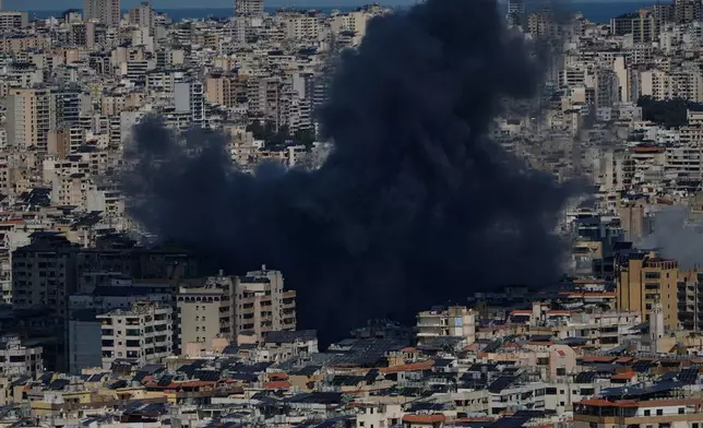 Smoke rises following an Israeli airstrike in Dahiyeh, Beirut's southern suburbs, Lebanon, Monday, March 9, 2026. (AP Photo/Bilal Hussein)