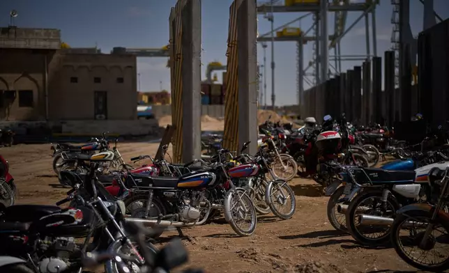 Motorcycles that belong to port workers are parked in an area at Umm Qasr Port, a deep-water port, in the city of Umm Qasr, Iraq, Friday, March 27, 2026. (AP Photo/Leo Correa)