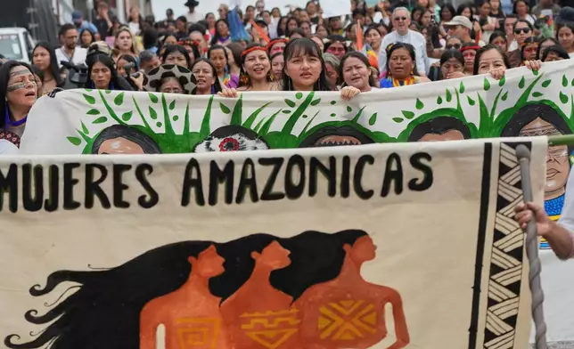 Indigenous women take part in a march marking International Women's Day in Puyo, Ecuador, Sunday, March 8, 2026. (AP Photo/Dolores Ochoa).