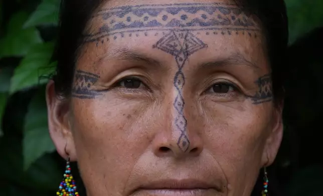 Salome Aranda, from the Indigenous Kichwa community, poses for a photo in Nueva Loja, Ecuador, Saturday, March 7, 2026. (AP Photo/Dolores Ochoa)