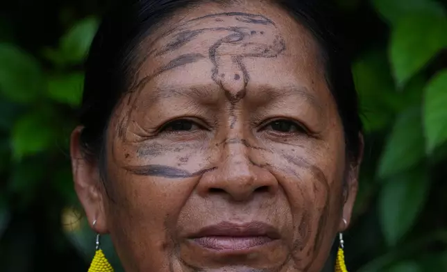 Flora Cadena, from the Andwa community, poses for a photo in Nueva Loja, Ecuador, Saturday, March 7, 2026. (AP Photo/Dolores Ochoa)