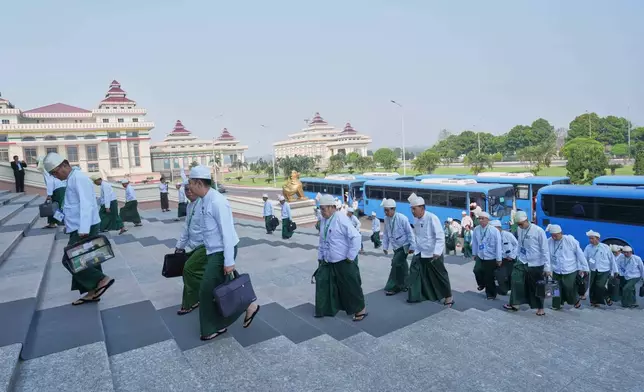 Myanmar lawmakers arrive to attend a session at Lower House of Parliament in Naypyitaw, Myanmar, Monday, March 30, 2026. (AP Photo/Aung Shine Oo)