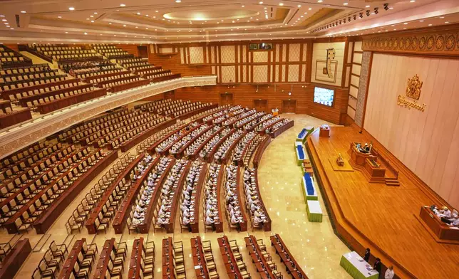 Myanmar lawmakers attend a session at Lower House of Parliament in Naypyitaw, Myanmar, Monday, March 30, 2026. (AP Photo/Aung Shine Oo)