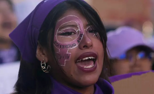 A woman shouts slogans during a march marking the upcoming International Women's Day, in La Paz, Bolivia, Friday, March 6, 2026. (AP Photo/Juan Karita)
