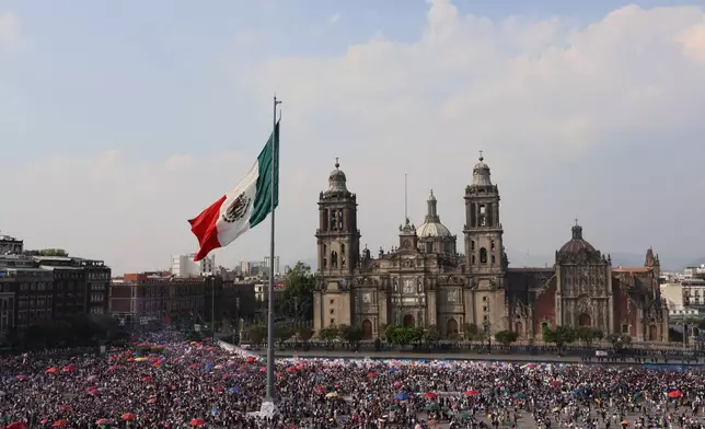 Protesters take part in a rally marking International Women's Day, at the Zocalo in Mexico City, Sunday, March 8, 2026. (AP Photo/Ginnette Riquelme)