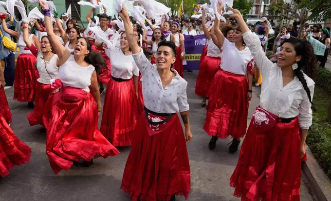 Demonstrators chant slogans as they march marking International Women's Day in Lima, Peru, Saturday, March 7, 2026. (AP Photo/Martin Mejia)