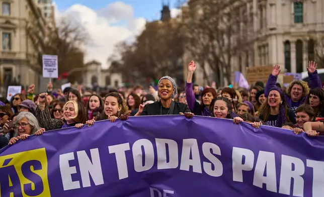 Women shout slogans during an International Women's Day protest in Madrid, Spain, Sunday, March 8, 2026. (AP Photo/Manu Fernandez)