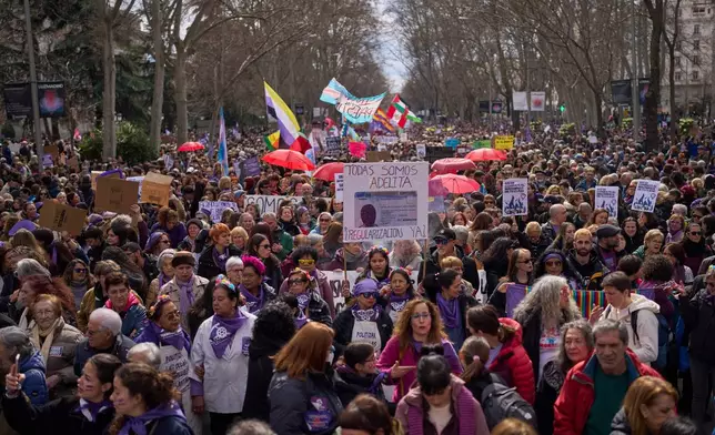 A woman shouts slogans during an International Women's Day protest in Madrid, Spain, Sunday, March 8, 2026. (AP Photo/Manu Fernandez)
