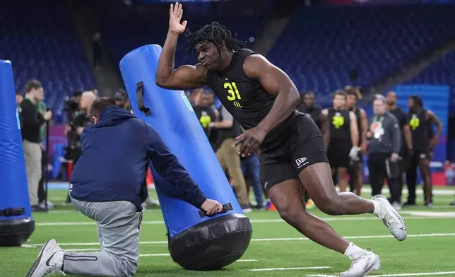 Texas Tech defensive lineman David Bailey (31) runs a drill at the NFL football scouting combine in Indianapolis, Thursday, Feb. 26, 2026. (AP Photo/Michael Conroy)