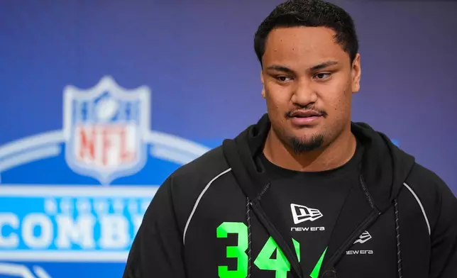Miami offensive lineman Francis Mauigoa (34) speaks during a press conference at the NFL football scouting combine in Indianapolis, Saturday, Feb. 28, 2026. (AP Photo/Michael Conroy)