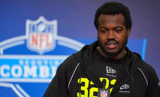 Miami defensive lineman Rueben Bain Jr. (32) speaks during a press conference at the NFL football scouting combine in Indianapolis, Wednesday, Feb. 25, 2026. (AP Photo/Michael Conroy)