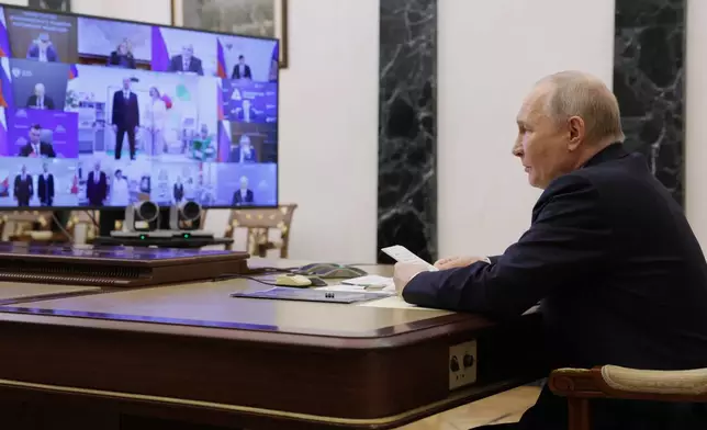 Russian President Vladimir Putin leads a cabinet meeting via videoconference at the Kremlin in Moscow, Wednesday, March 4, 2026. (Gavriil Grigorov/Sputnik, Kremlin Pool Photo via AP)