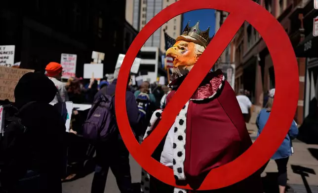 A person demonstrates during a "No Kings" protest Saturday, March 28, 2026, in Nashville, Tenn. (AP Photo/George Walker IV)
