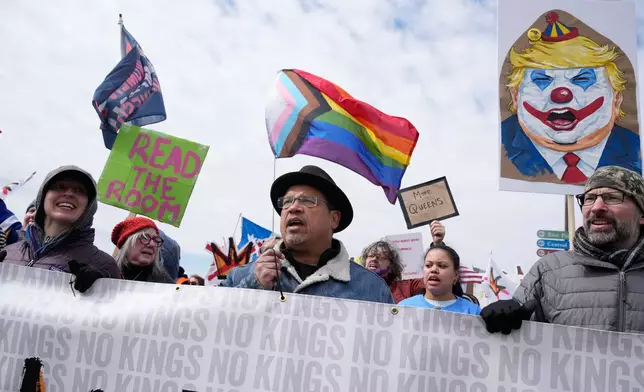 People gather at Saint Paul College during a "No Kings" protest Saturday, March 28, 2026, in St. Paul, Minn. (AP Photo/Joe Scheller)
