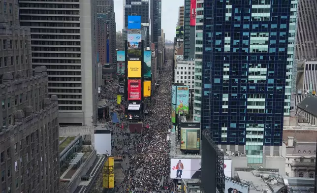 People take part in a "No Kings" protest Saturday, March 28, 2026, in New York. (AP Photo/Adam Gray)