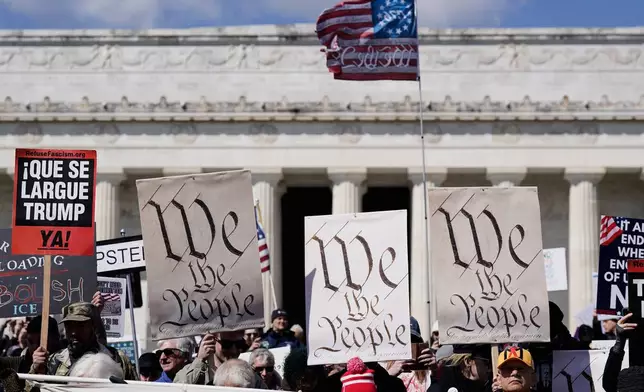 Demonstrators rally in front of the Lincoln Memorial during the No Kings protest in Washington, Saturday, March 28, 2026. (AP Photo/Jose Luis Magana)