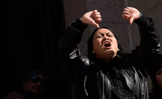 A person reacts during a "No Kings" protest Saturday, March 28, 2026, in St. Paul, Minn. (AP Photo/Joe Scheller)