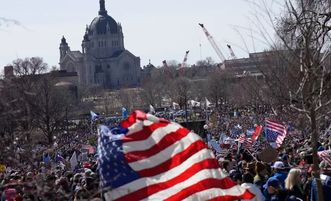 People take part in a "No Kings" protest Saturday, March 28, 2026, in St. Paul, Minn. (AP Photo/Joe Scheller)