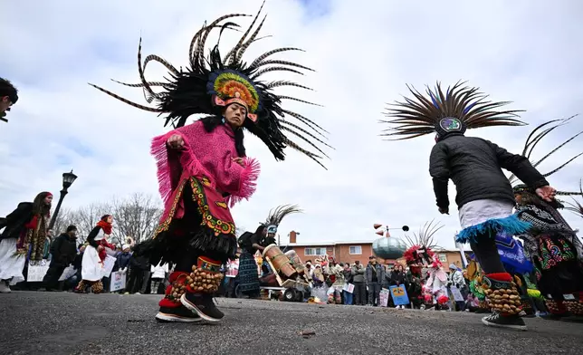 Maryanne Quiroz, lead dancer with Kalpulli Yaocenoxtli, performs at Western Park during"No Kings" protest Saturday, March 28, 2026, in St. Paul, Minn. (AP Photo/Tom Baker)