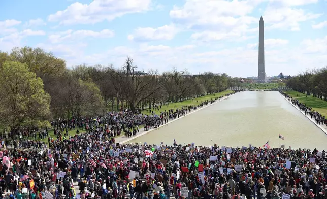 EDS NOTE: OBSCENITY - Demonstrators rally in front of the Lincoln Memorial during the No Kings protest in Washington, Saturday, March 28, 2026. (AP Photo/Tom Brenner)