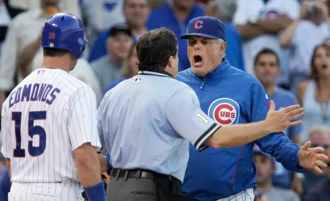 FILE - Chicago Cubs manager Lou Piniella, right, argues with home plate umpire Ed Rapuano after Jim Edmonds, left, was ejected during the 11th inning of a baseball game against the Milwaukee Brewers at Wrigley Field in Chicago, Sept. 18, 2008. (AP Photo/Charles Rex Arbogast, File)