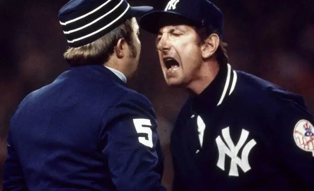 FILE - In this Oct. 21, 1976, file photo, New York Yankees manager Billy Martin argues a call with first base ump Bruce Froemming during the fourth game of baseball's World Series against the Cincinnati Reds at Yankee Stadium in New York. (AP Photo, File)
