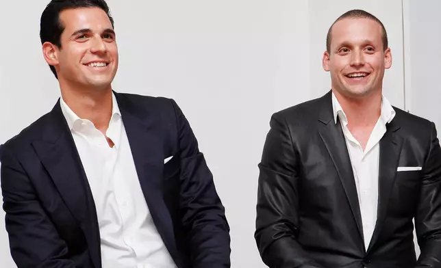 FILE - Oren and Tal Alexander speak at a panel at the Rockstars of Real Estate Event in New York., on Sept. 3, 2013. (Photo by Amy Sussman/Invision for DETAILS Magazine/AP Images, File)