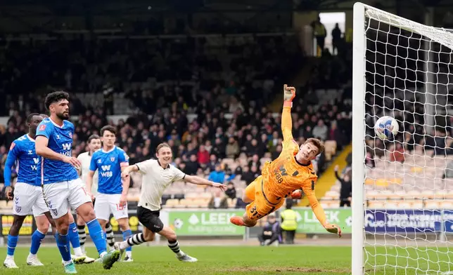 Port Vale's Ben Waine scores his side's first goal of the game, during the FA Cup fifth round soccer match between Sunderland and Port Vale, in Stoke on Trent, England, Sunday March 8, 2026. (Nick Potts/PA via AP)
