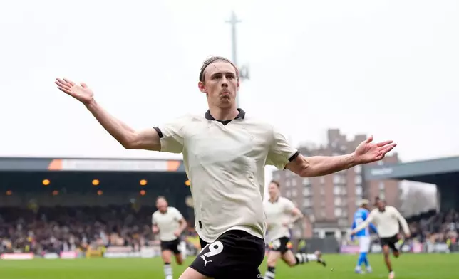 Port Vale's Ben Waine celebrates after scoring his side's first goal of the game during the FA Cup fifth round soccer match between Sunderland and Port Vale, in Stoke on Trent, England, Sunday March 8, 2026. (Nick Potts/PA via AP)