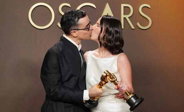Alexandre Singh, left, and Natalie Musteata, winners of the award for live action short film for "Two People Exchanging Saliva," pose in the press room at the Oscars on Sunday, March 15, 2026, at the Dolby Theatre in Los Angeles. (Photo by Jordan Strauss/Invision/AP)