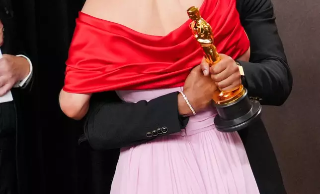 Jessie Buckley, left, and Michael B. Jordan, winner of the award for actor in a leading role for "Sinners," pose in the press room at the Oscars on Sunday, March 15, 2026, at the Dolby Theatre in Los Angeles. (Photo by Jordan Strauss/Invision/AP)