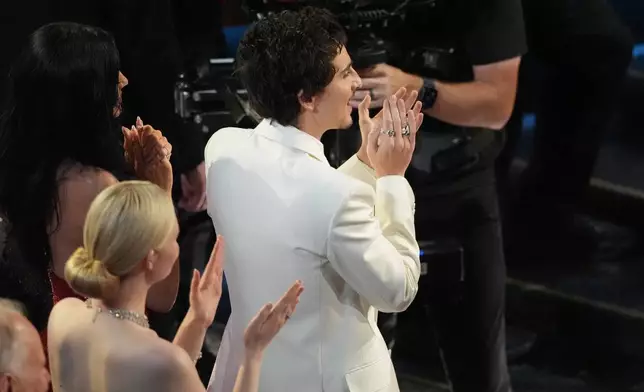 Timothee Chalamet in the audience clapping for Michael B. Jordan during the Oscars on Sunday, March 15, 2026, at the Dolby Theatre in Los Angeles. (AP Photo/Chris Pizzello)