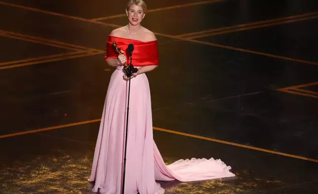 Jessie Buckley accepts the award for actress in a leading role for "Hamnet" during the Oscars on Sunday, March 15, 2026, at the Dolby Theatre in Los Angeles. (AP Photo/Chris Pizzello)