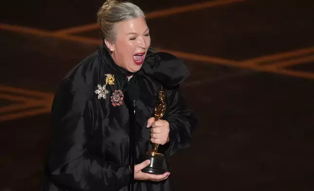 Kate Hawley accepts the award for costume design for "Frankenstein" during the Oscars on Sunday, March 15, 2026, at the Dolby Theatre in Los Angeles. (AP Photo/Chris Pizzello)