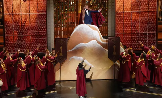 Host Conan O'Brien, top, and Josh Groban perform during the Oscars on Sunday, March 15, 2026, at the Dolby Theatre in Los Angeles. (AP Photo/Chris Pizzello)