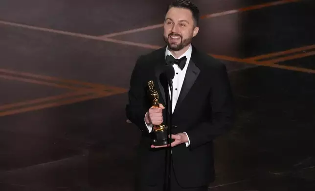 Andy Jurgensen accepts the award for film editing for "One Battle After Another" during the Oscars on Sunday, March 15, 2026, at the Dolby Theatre in Los Angeles. (AP Photo/Chris Pizzello)