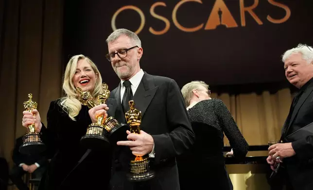Sara Murphy, left, winner of the award for best picture for "One Battle After Another," and Paul Thomas Anderson, winner of the awards for writing (adapted screenplay), directing, and best picture for "One Battle After Another," attend the Governors Ball after the Oscars on Sunday, March 15, 2026, in Los Angeles. (AP Photo/John Locher)