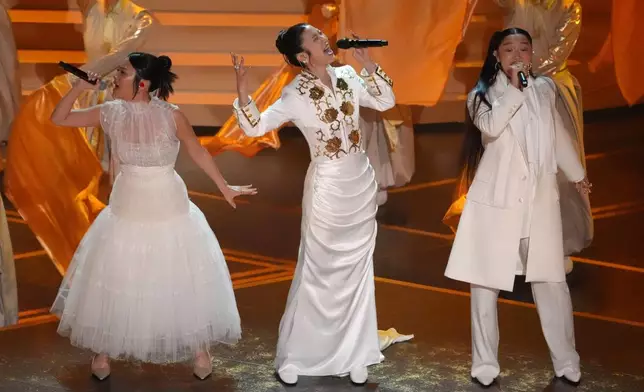 Rei Ami, from left, EJAE, and Audrey Nuna perform 'Golden' from "K-Pop Demon Hunters" during the Oscars on Sunday, March 15, 2026, at the Dolby Theatre in Los Angeles. (AP Photo/Chris Pizzello)