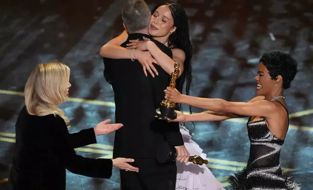 Sara Murphy, from left, Paul Thomas Anderson, Chase Infiniti, and Teyana Taylor win the award for best picture for "One Battle After Another" during the Oscars on Sunday, March 15, 2026, at the Dolby Theatre in Los Angeles. (AP Photo/Chris Pizzello)